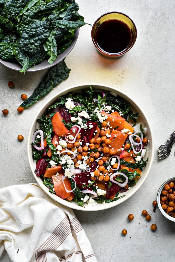 Top view of the finished salad with kale, roasted chickpeas, roasted beets, feta cheese.
