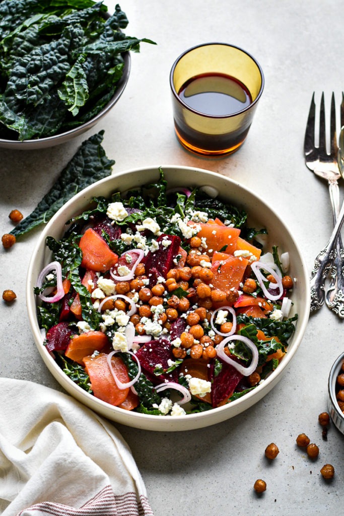 Top view of the finished salad with kale, roasted chickpeas, roasted beets, feta cheese.