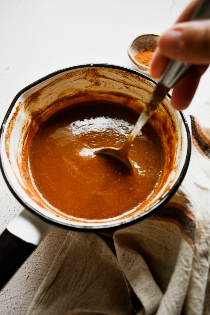 Pumpkin sauce in a saucepan after cooking down.