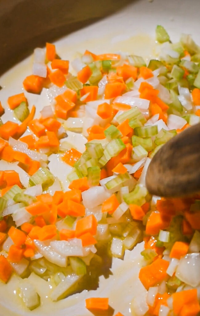 Sautéing onion, carrots and celery.