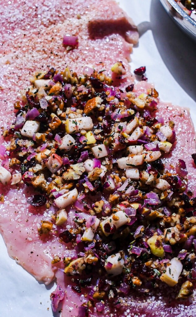 Butterflied turkey breast with apple pecan cranberry filling layered on top.