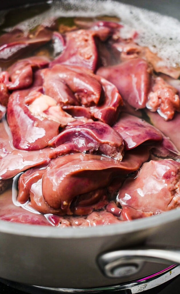Chicken livers simmering in white wine.