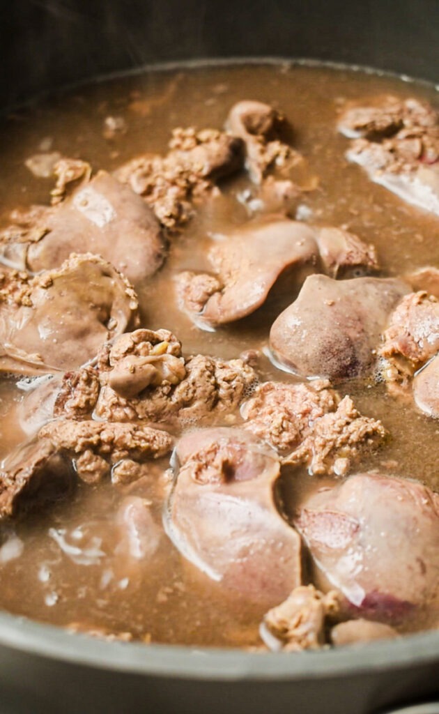 Chicken livers in the white wine after they are cooked.