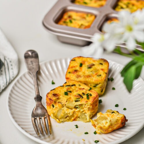Starbucks Potato cheddar and chive bakes on a plate with a fork.