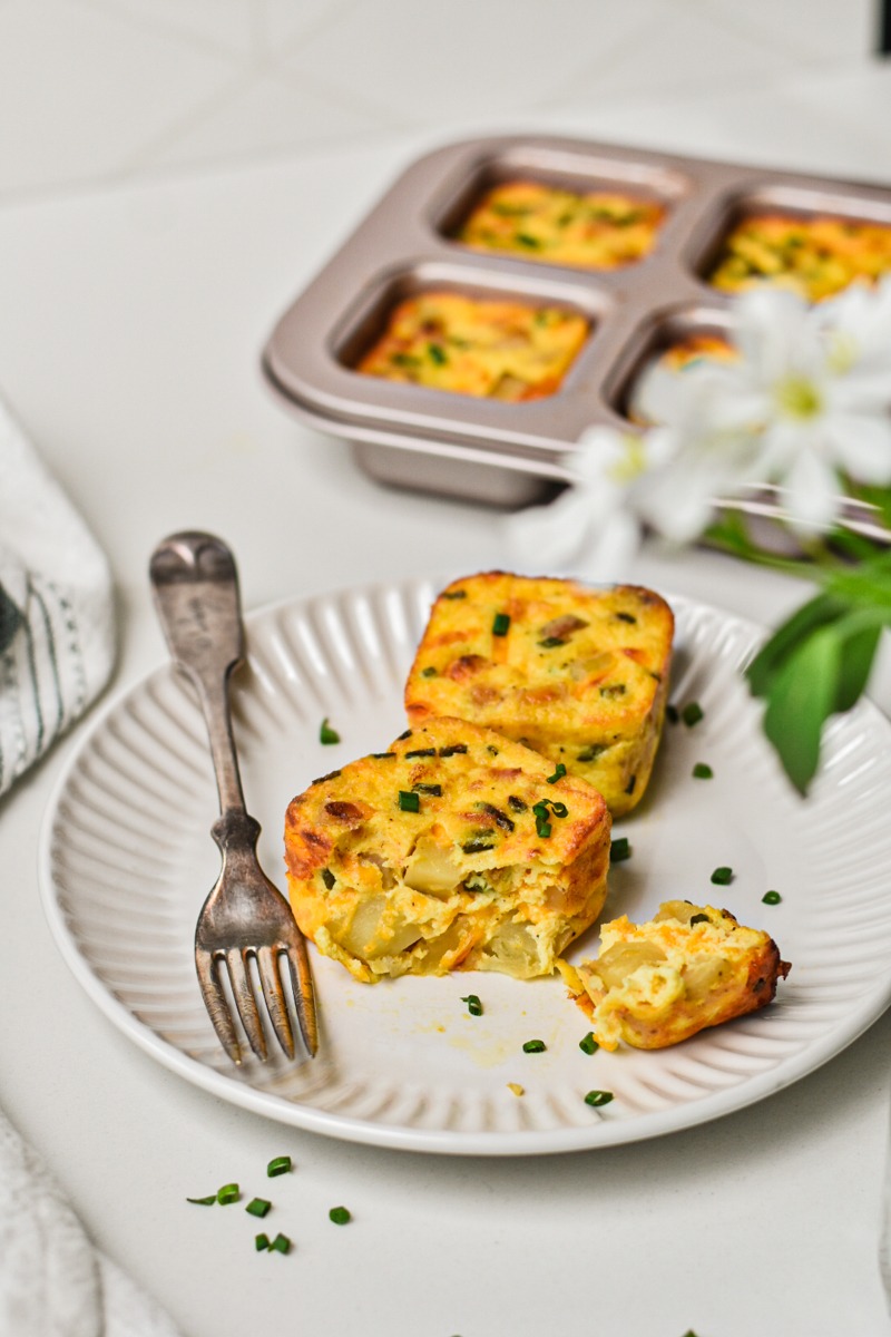 Starbucks Potato cheddar and chive bakes on a plate with a fork.