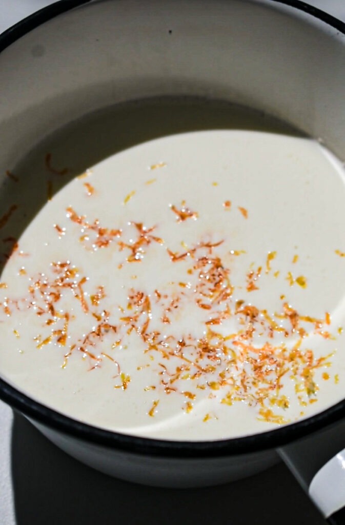 Grapefruit zest in a saucepan of heavy cream.
