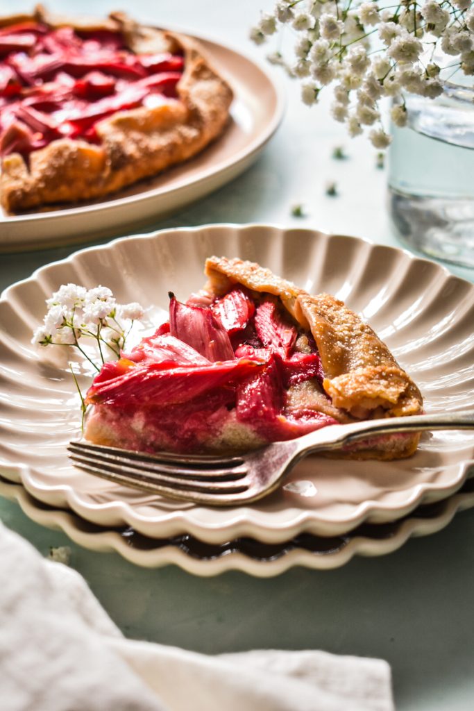 A slice of moist rhubarb ginger almond cake with crunchy crust