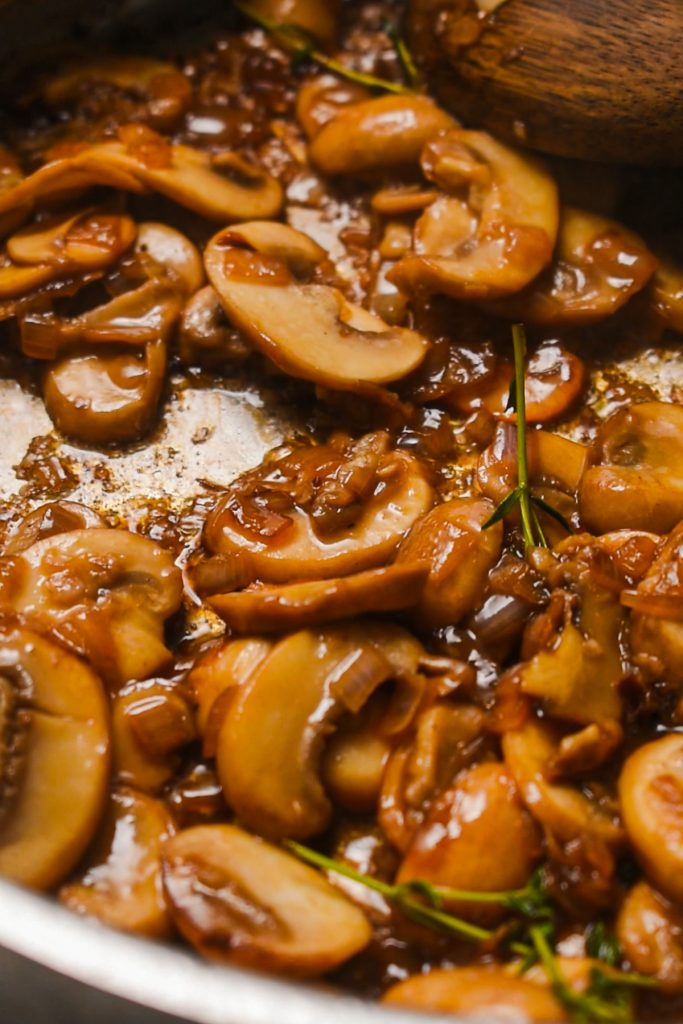 shot of mushroom, thyme and garlic in white wine sauce