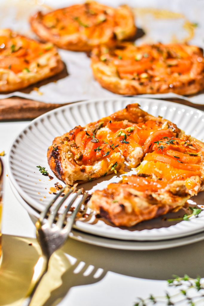 image of a plate with 2 slices of goat and cheese apricot mini galettes