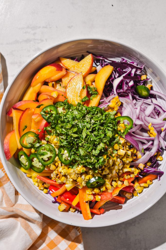 Overhead shot of summer slaw in a bowl before the dressing is added.