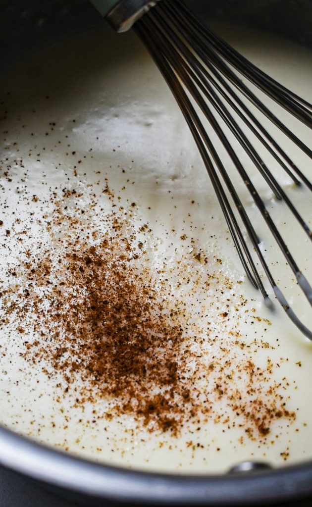 Nutmeg and cayenne pepper sprinkled into the bechamel sauce.