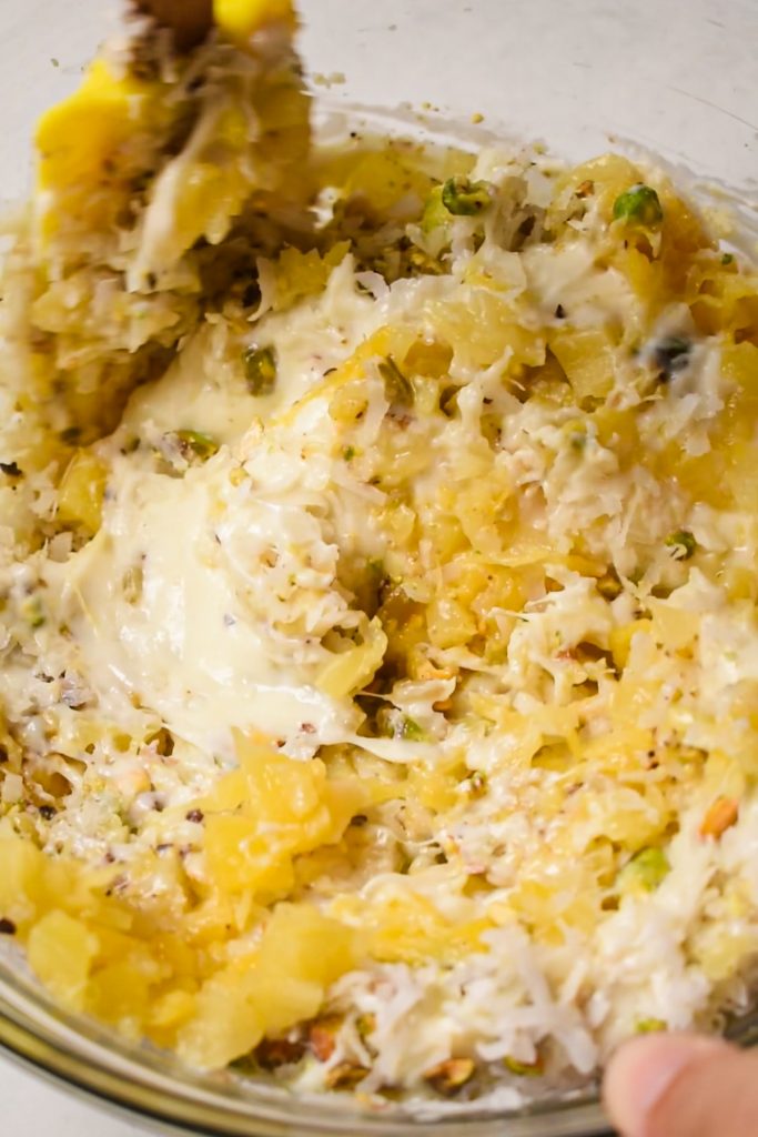 Mixing the pie filling together in a mixing bowl.