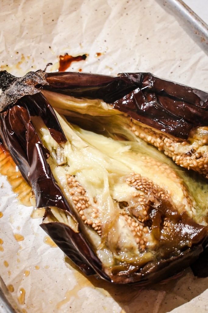 Roasted eggplant sliced open to see the inside.