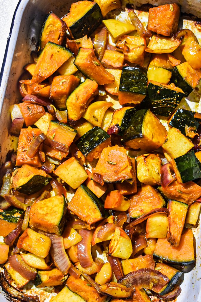 Roasted vegetables in a baking dish.