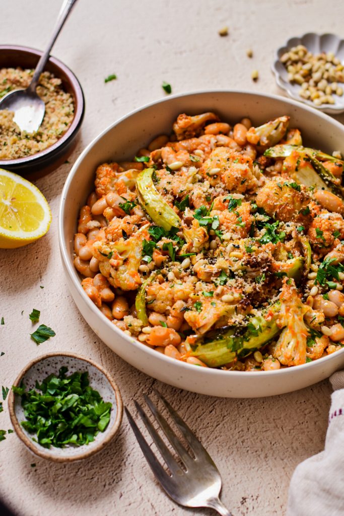 Roasted cauliflower and cannellini bean salad topped with breadcrumbs and fresh parsley.