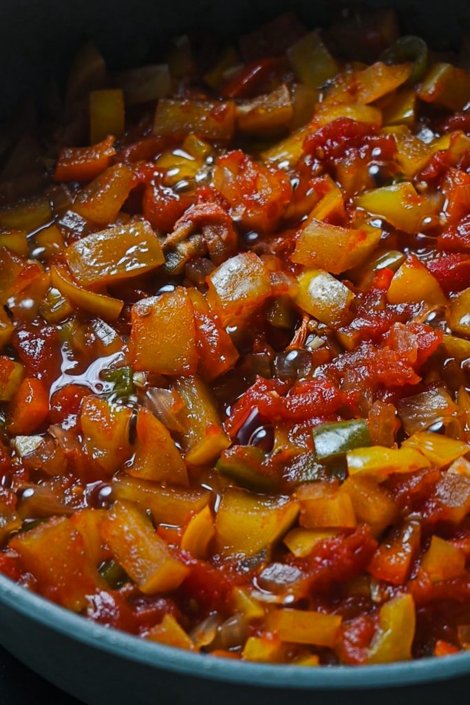 Apple salsa mixture cooked down in a sauce pan.