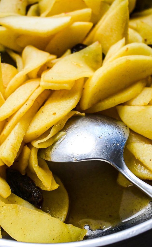 Cooking together the apples, sugar, and spices.