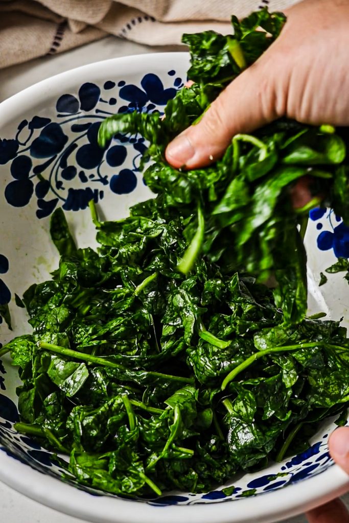Crushed spinach after massaging the salt into the spinach.