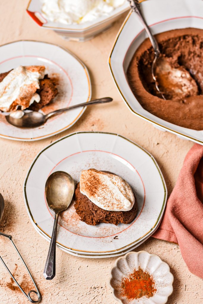 Mouse served on plates with a dollop of whipped cream and a sprinkle of cinnamon on top.
