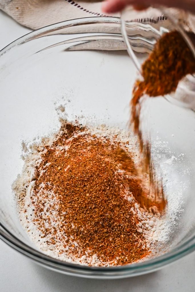 Flour and spices in a mixing bowl.