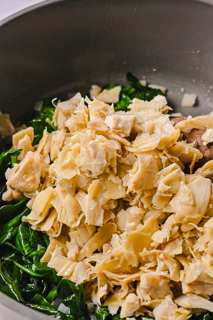 Canned artichoke hearts added to the spinach and onion mixture.