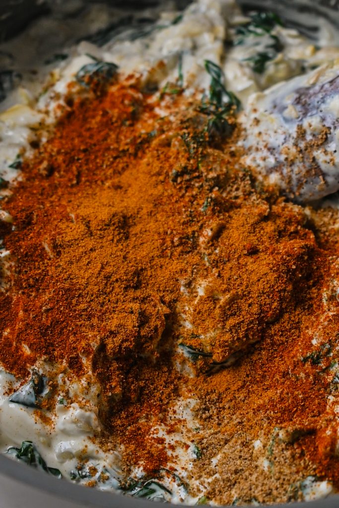 Old bay seasoning and other spices added to the creamy spinach artichoke mixture.