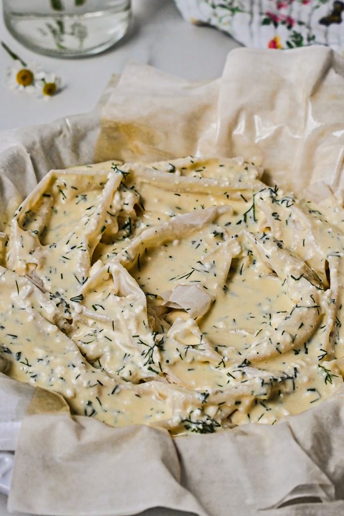 Assembled phyllo pie with the farmer cheese filling before baking.
