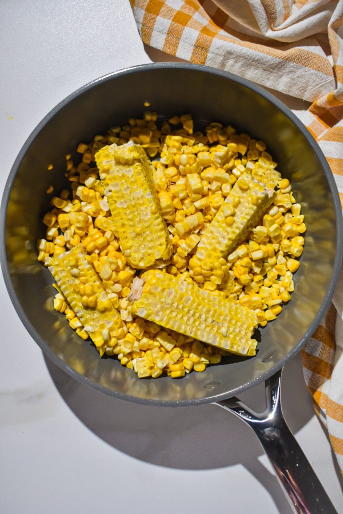 Sweet corn kernels in a saucepan.