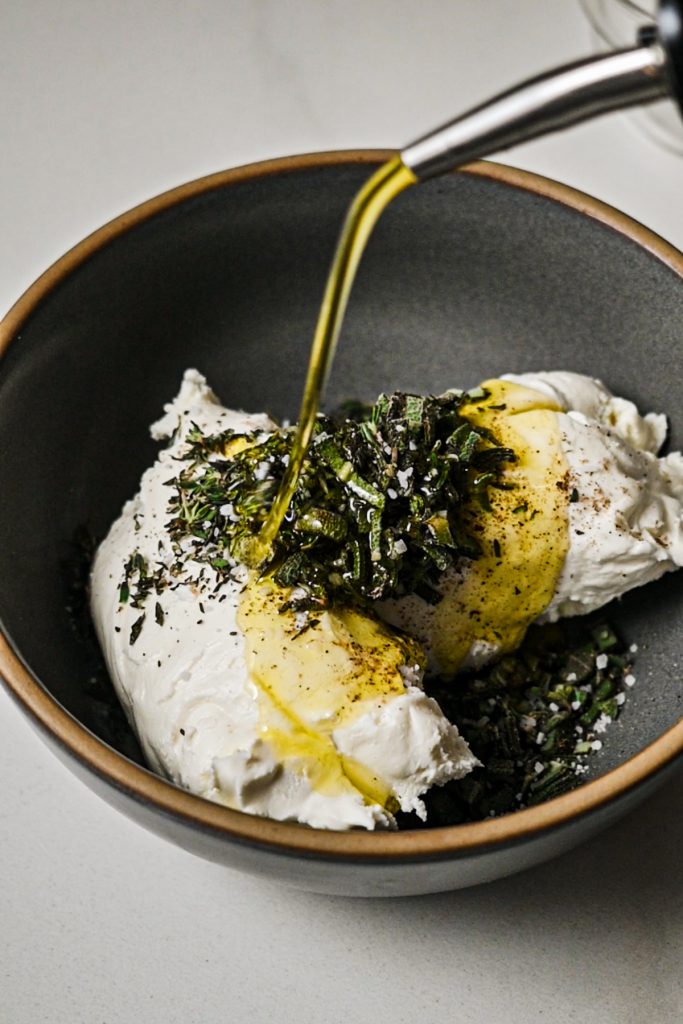 Making the goat cheese mixture in a bowl.