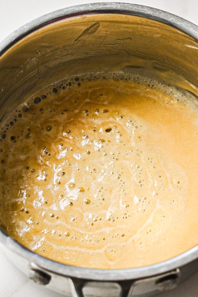 Cooking butter and flour in a saucepan.