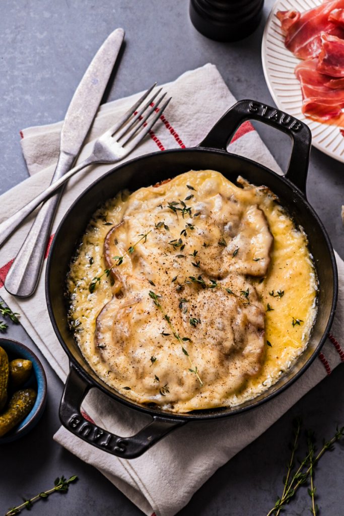 French cheese on toast served in a cast iron skillet.