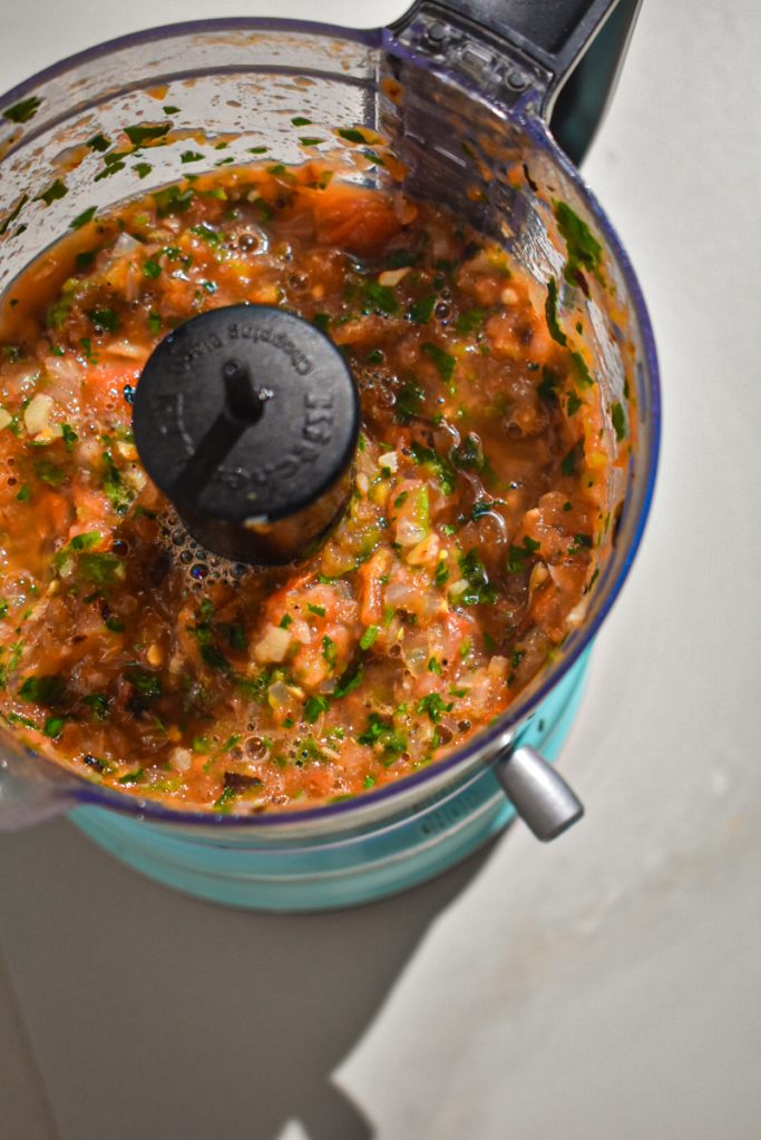 Grilled peach and tomato salsa in the food processor after blending.