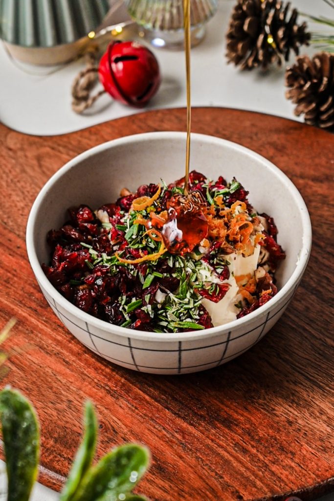 Mixing the marscapone cheese mixture in a bowl.