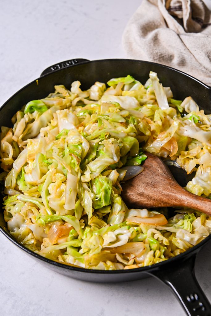 Caramelized cabbage and onions in a cast iron skillet.