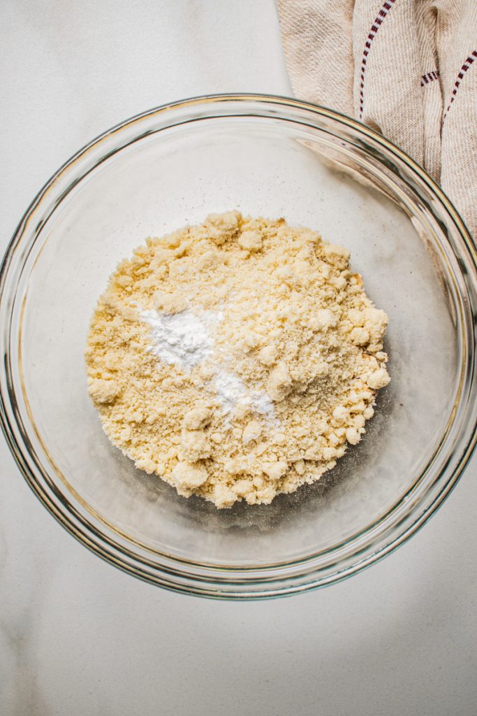 Almond flour and baking powder in a mixing bowl.
