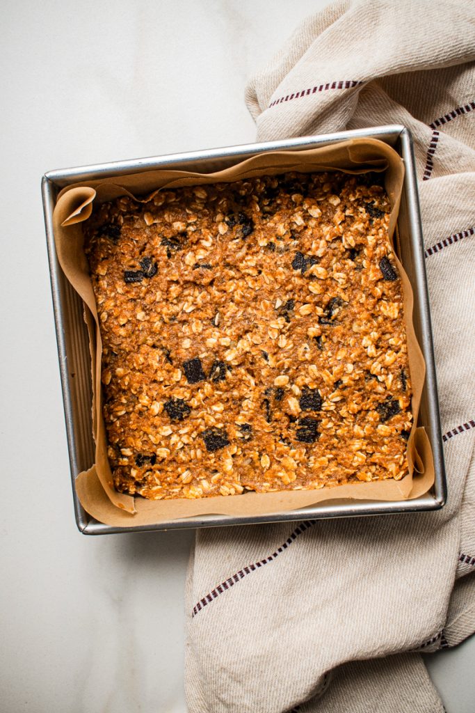 Pumpkin chocolate baked oats mixture placed in a baking dish.